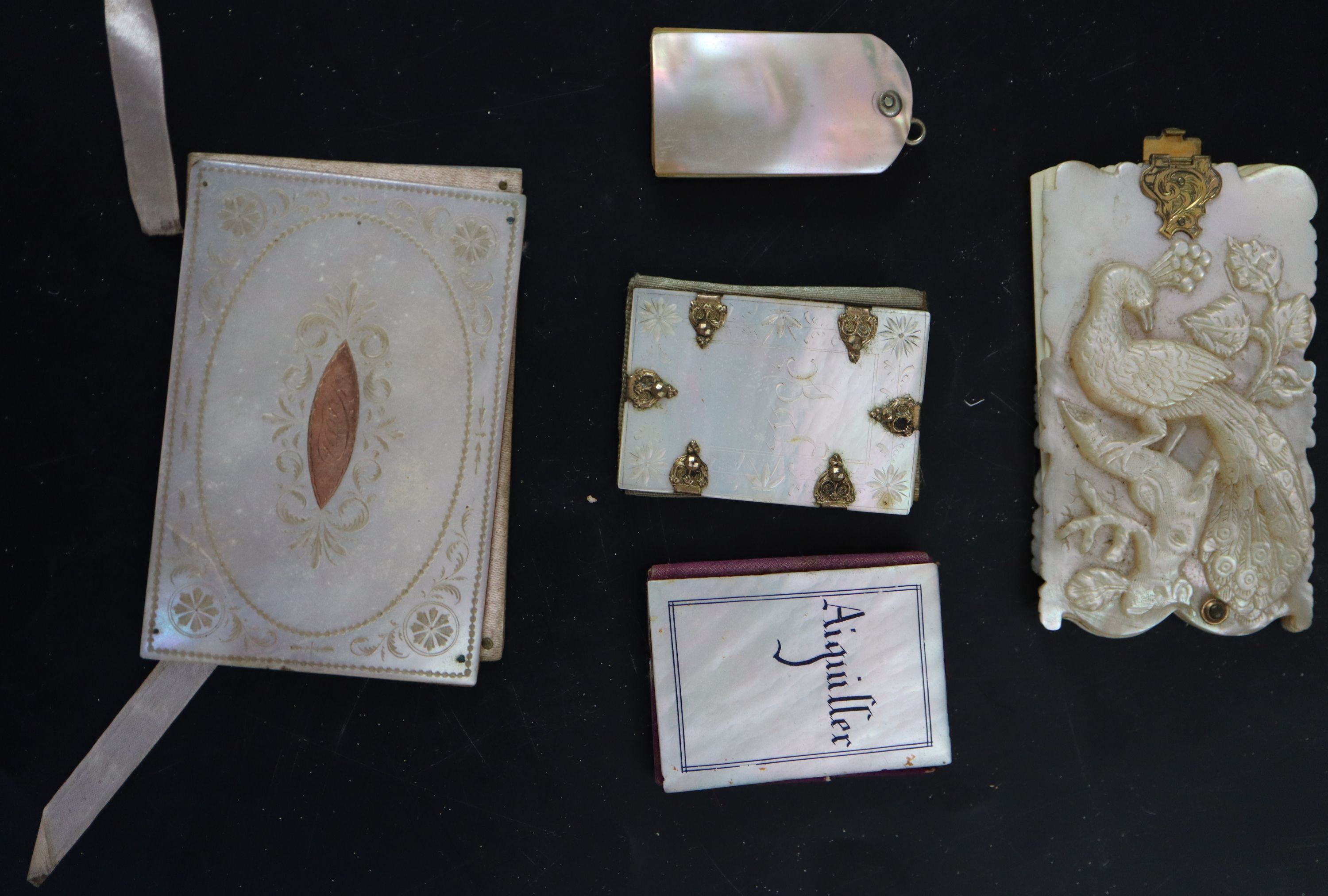 A collection of 19th century Palais Royale mother of pearl note cases and dance cards, largest 9cm (7)